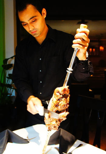 Gaucho Emerson Primo carves lamb.JPG